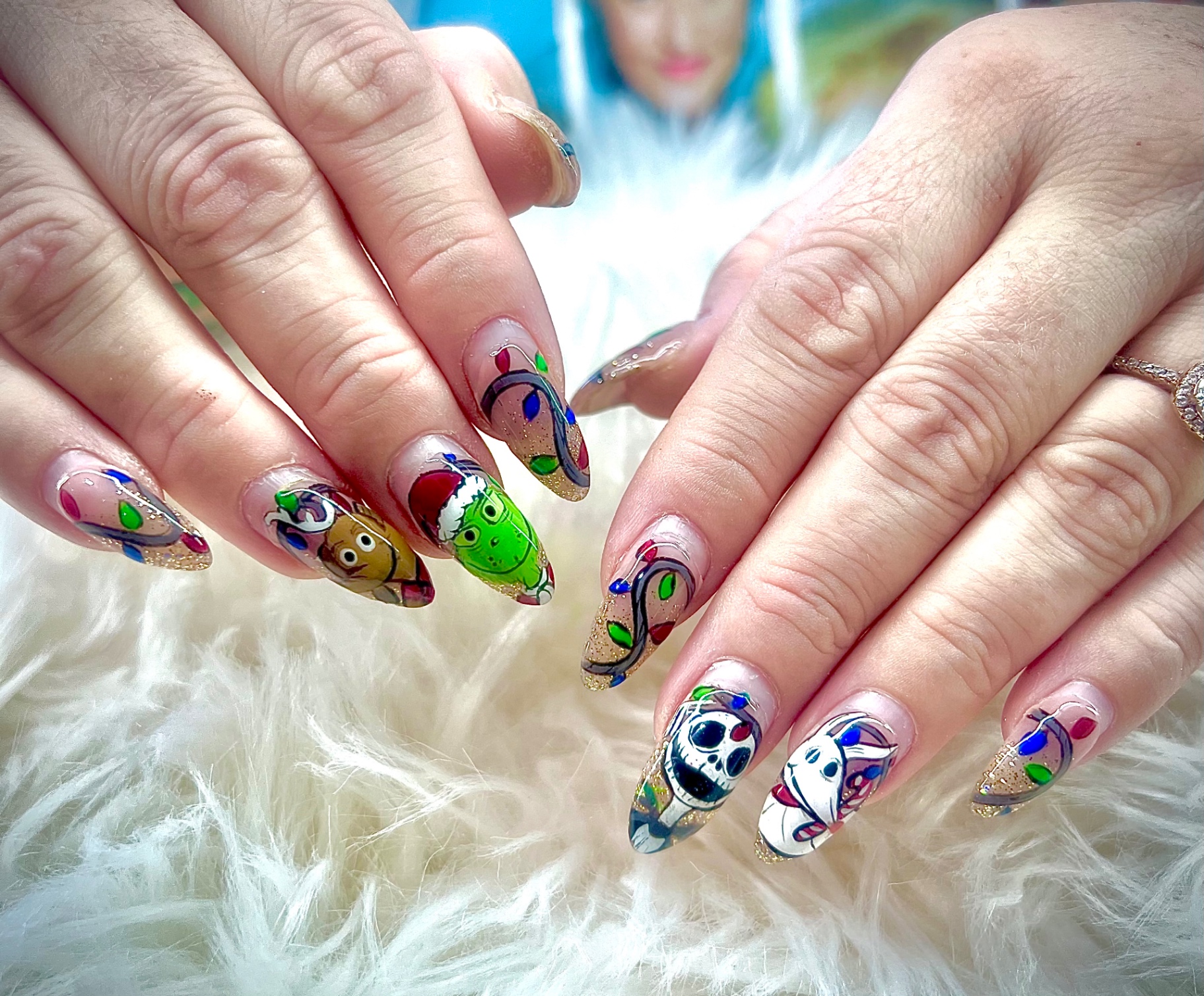 Holiday nail art with Grinch, reindeer and Jack Skellington