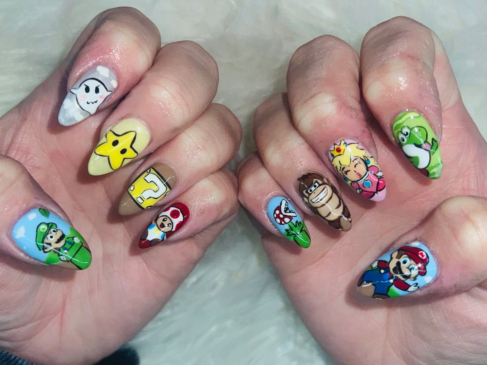 Hand-painted Super Mario character nail art